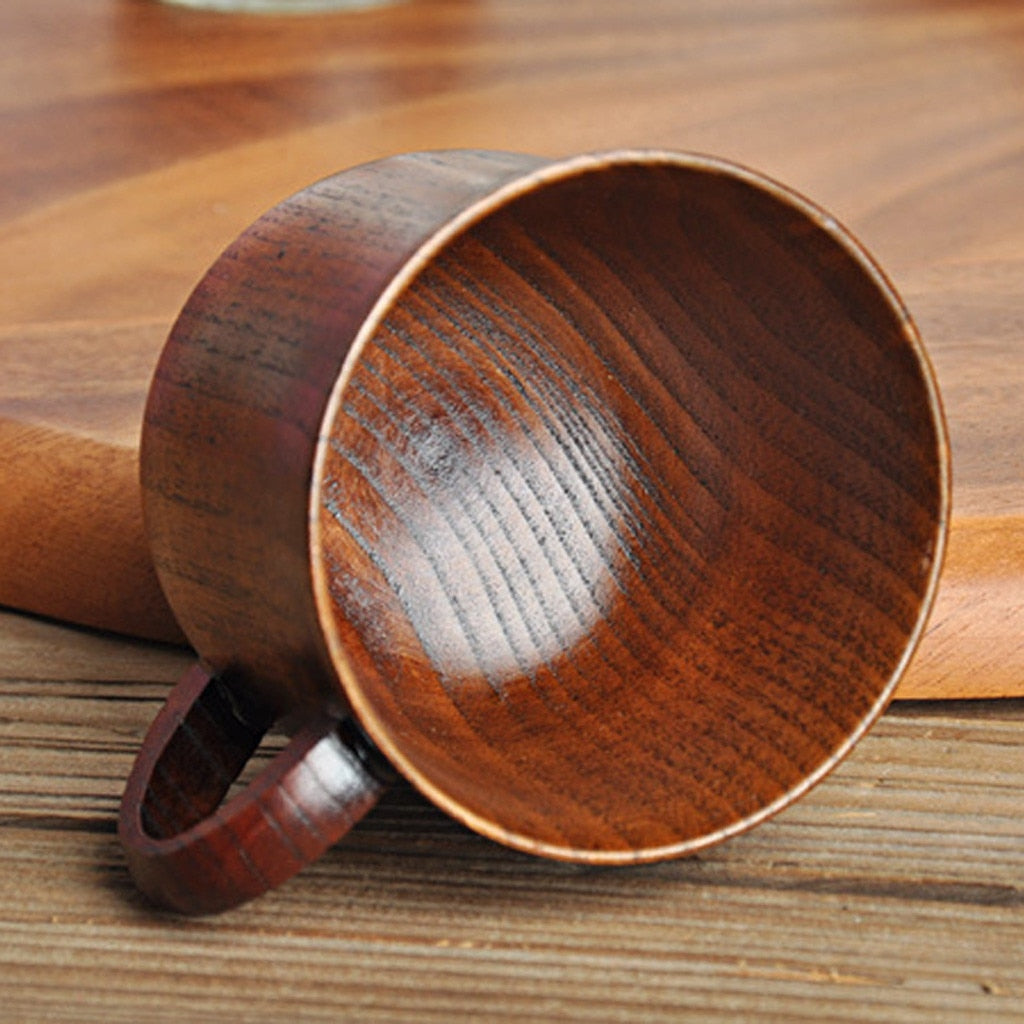 tilted over wood mug on a table 